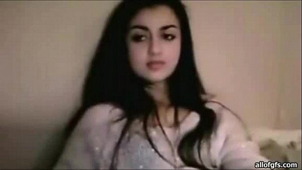 Beautiful Indianwoman with longblack hair in her robe_sitting_on a bed