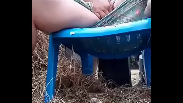 Thai aunty in a chair outdoor 