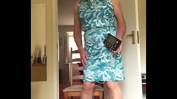 Johanna in green dress receives electric shock to cock. 