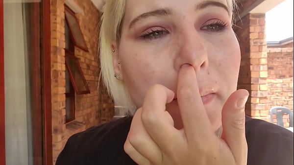 Blonde blows out boogers out_of her_nose and plays with it nose picking fetish