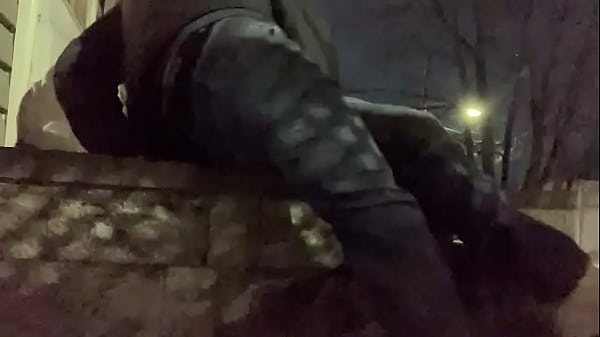 Massage deep fascia with balls on stoop at night 