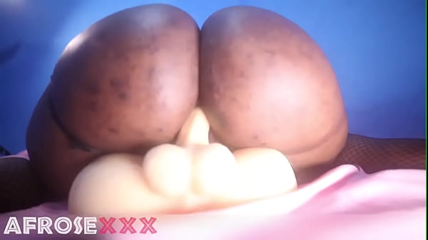 Lonely African woman riding_a male torso sextoy