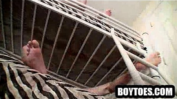 Two hunks tugging on their cocks on a bunk bed 