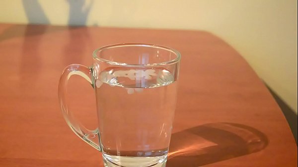 Cumming into glass of water 
