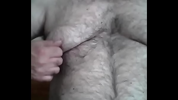 Watching TV playing with my nipples