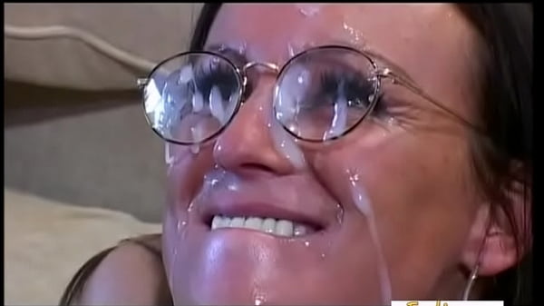 Brunettereceives a ton_of jizz_on her nerdy glasses