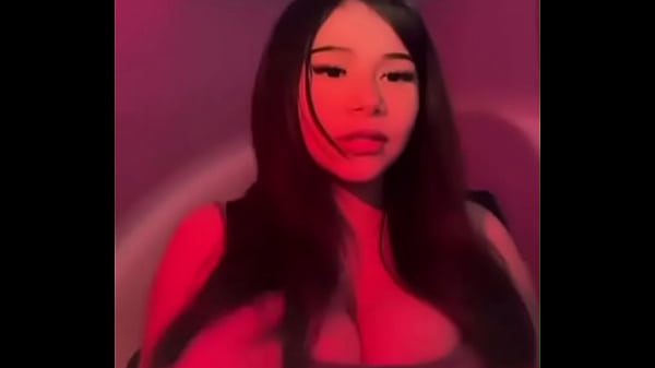 Hot big boobed babe fixing her shirt