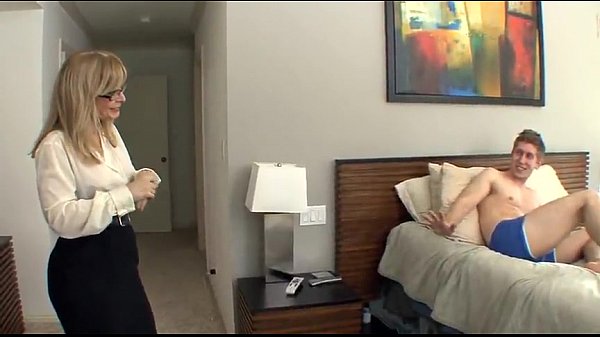 Busty cougarNina Hartley fucks a young guy