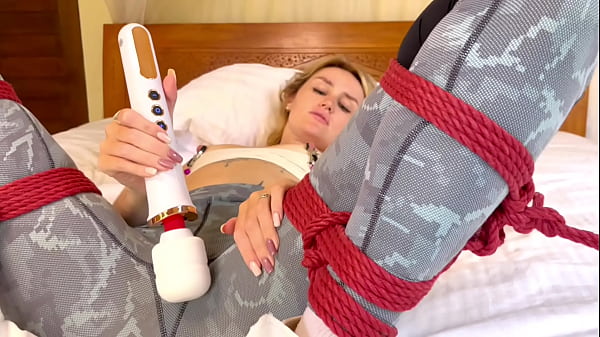 Using a magic wang while dressed in leggings