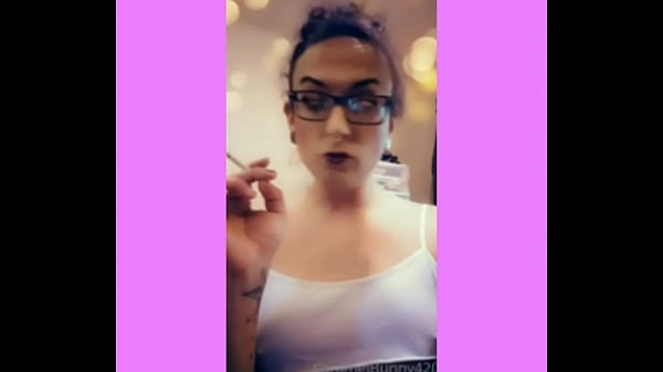 Horny shemale Snowbunny tgirl seductively smoking w her tits perked up 