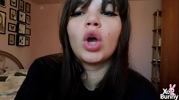 Brunette with natural big lips smoking without lip makeup 