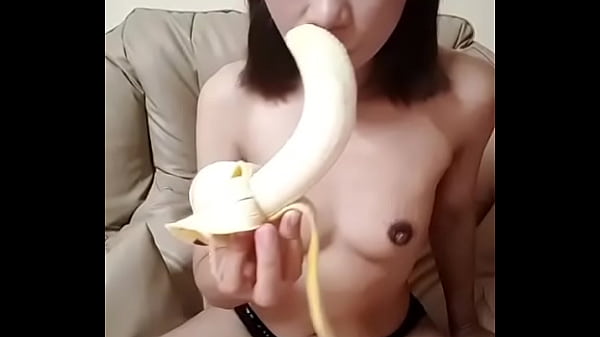 Beautiful asiangirl sucking banana