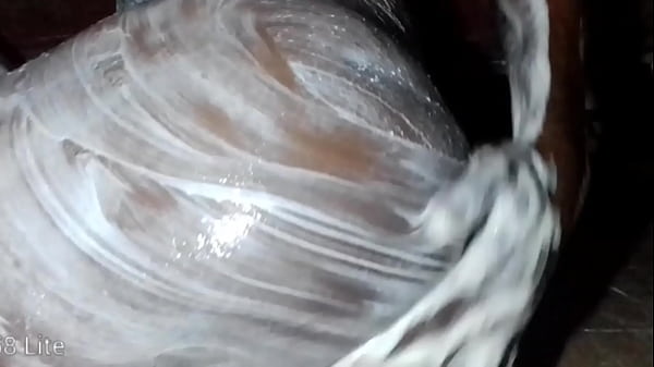 African lonely man pours body lotion on this cock and ass 