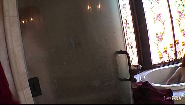 The busty girl got horny while watching a friend masturbate in the bathtub so she started rubbing her pussy in the shower before helping out the other girl with a purple dildo 