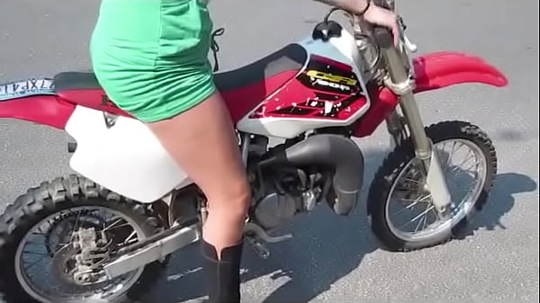 Girl revving a dirtbike 
