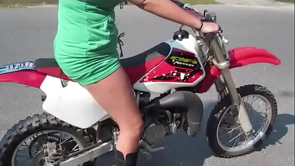 Girl revving a dirtbike 
