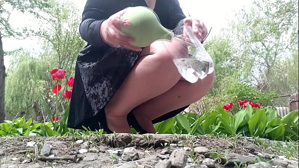 Enema to a fat woman in a public park 