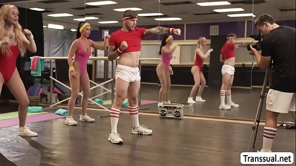 Busty shemale fucks her busty gym buddy and rides coach cock