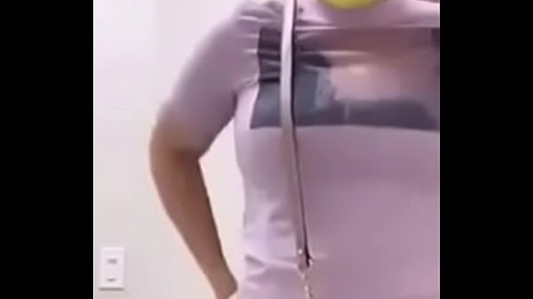 Cute lady shows off her big ass at a public restroom