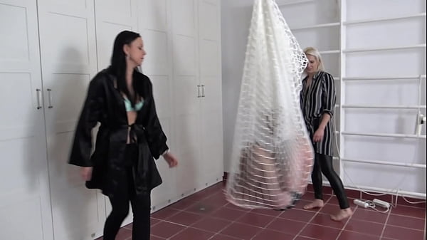 Madame Carla And Amber Hang Their Slaves In A In The Room And Kick Them Together Heartily From All Sides. thumbnail