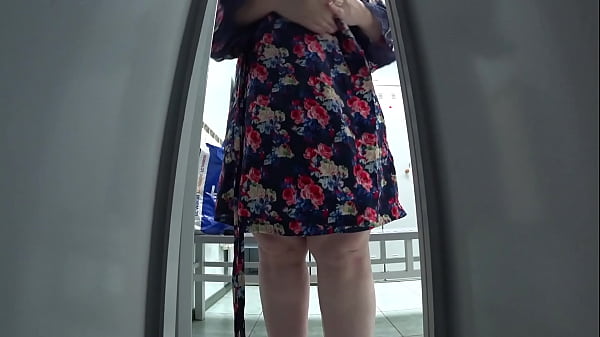 Hidden camera in a cubicle in a public locker room caught a fat mommy with an appetizing booty and saggy tits in her lens peeping