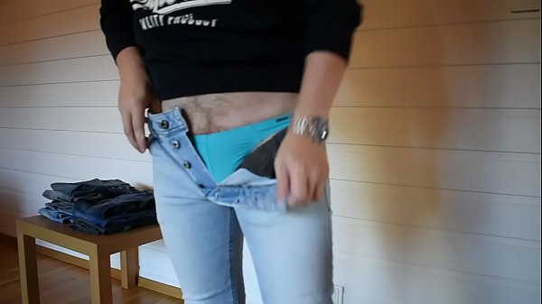 Trying on tight jeans 