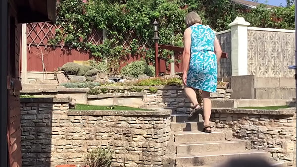 Green Dress in garden - Transvestite pose outdoors 