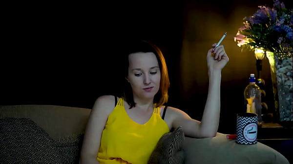 Sucking on a cigarette and looking at you 