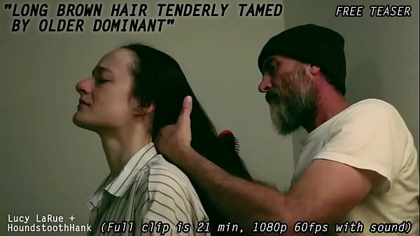 Long brown hair tenderly tamed by older dominant0