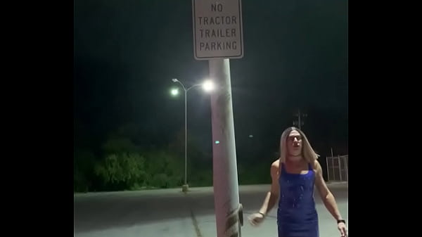 Cross dressing in a blue latex dress 