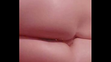 Enjoying small bowling pin in her ass