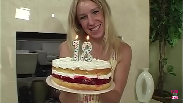 A stunning blonde woman adorned with a birthday gift delivers an exceptional blowjob to her partner