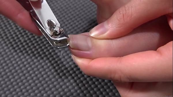 Woman cutting toenails