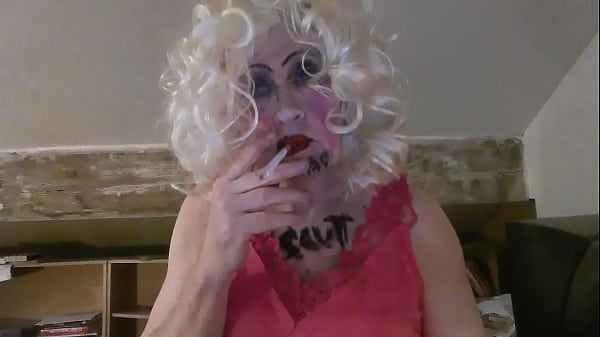 See Sarah's true name inscribed on her chest and face - fag slut - as she feverishly masturbates, smokes and  penetrates herself anally - all for your  anticpated delight. 'I so want your hard cock' she says 