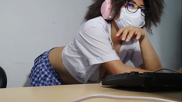 Beautiful student is getting excited while singing while doing_homework
