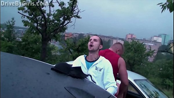 A girl shoves_her butt through the car window for anyoneto fuck at public orgy