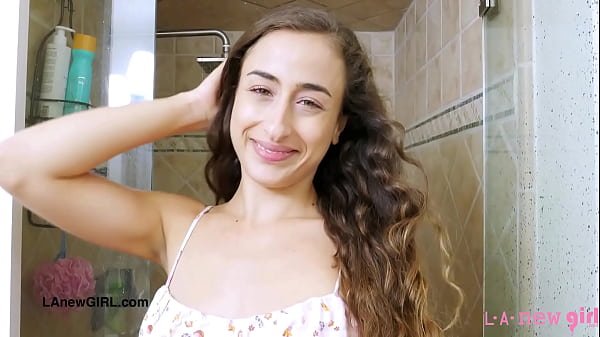 Sexy brunette model enjoys a sensual bath