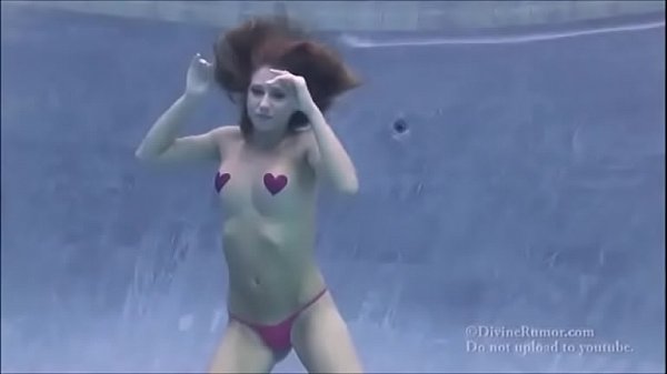Underwater topless in the pool 