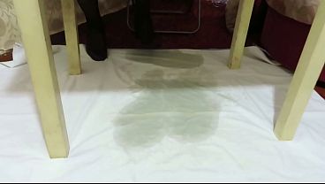 A chubby beauty pees while reading a book homemade urine fetish 