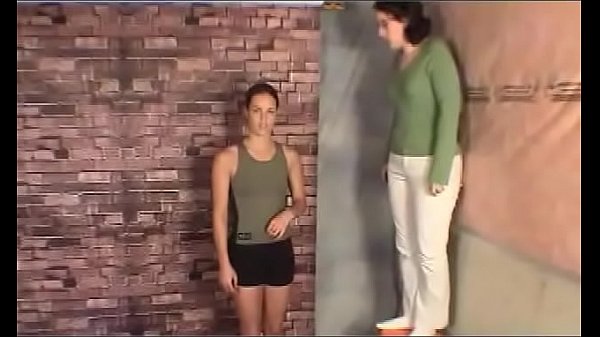 Model lifts girl in green