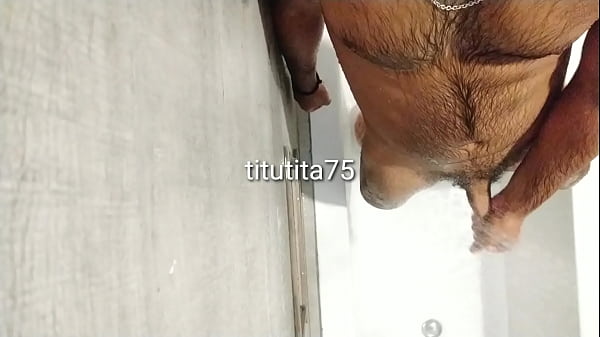 Cleaning body and cock in shower 