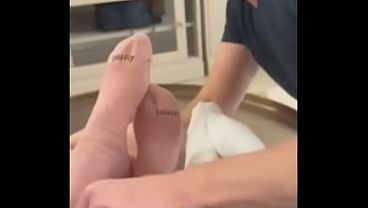 Kirstin, Luna, and Giggi are having fun with their foot slave. 