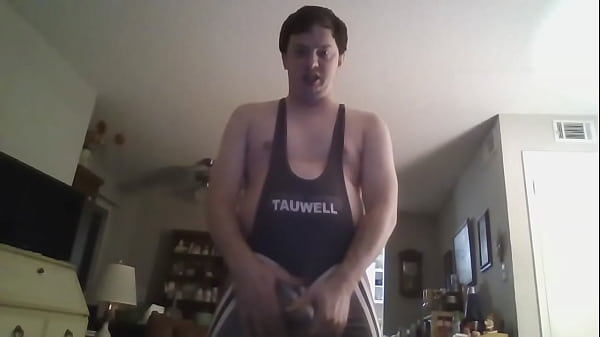 Young Man Playing with His Penis in a Westling Suit and Underwear