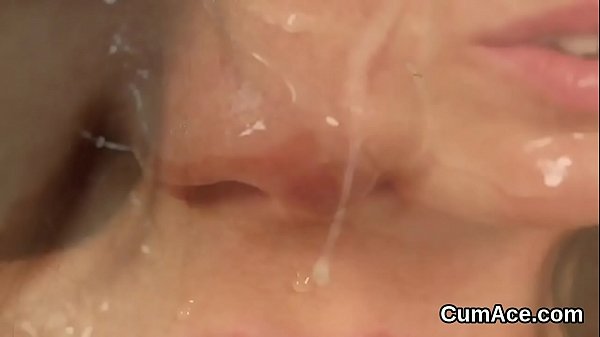 Flirty babe gets cumshot on her face sucking all the cum 
