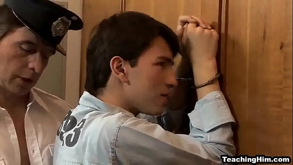 Twink stud giving a blowjob to a police officer 