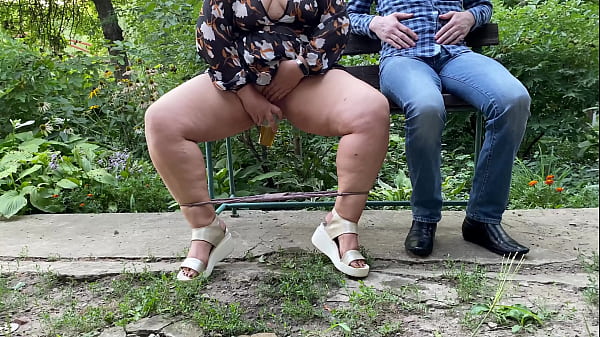 Sexy MILF with gorgeous legs pissesinto a_glass and gives_it to a_stranger