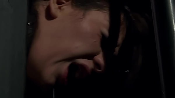 She is in rope chest harness and her hands are lifted up at her behind and she suffers while her master whipping her