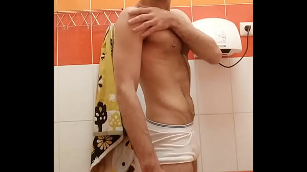 Hairy guy touching herself in the gym toilet