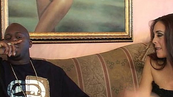 Sexy brunette MILF with big tits seduces a young black cock 