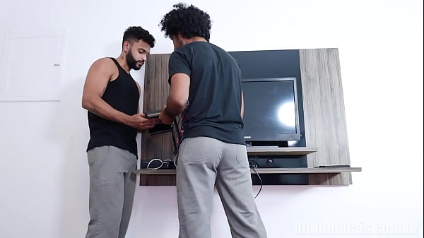 A couple has sex in the bedroom and the internet technicians in the living room. They get together and make an orgy 